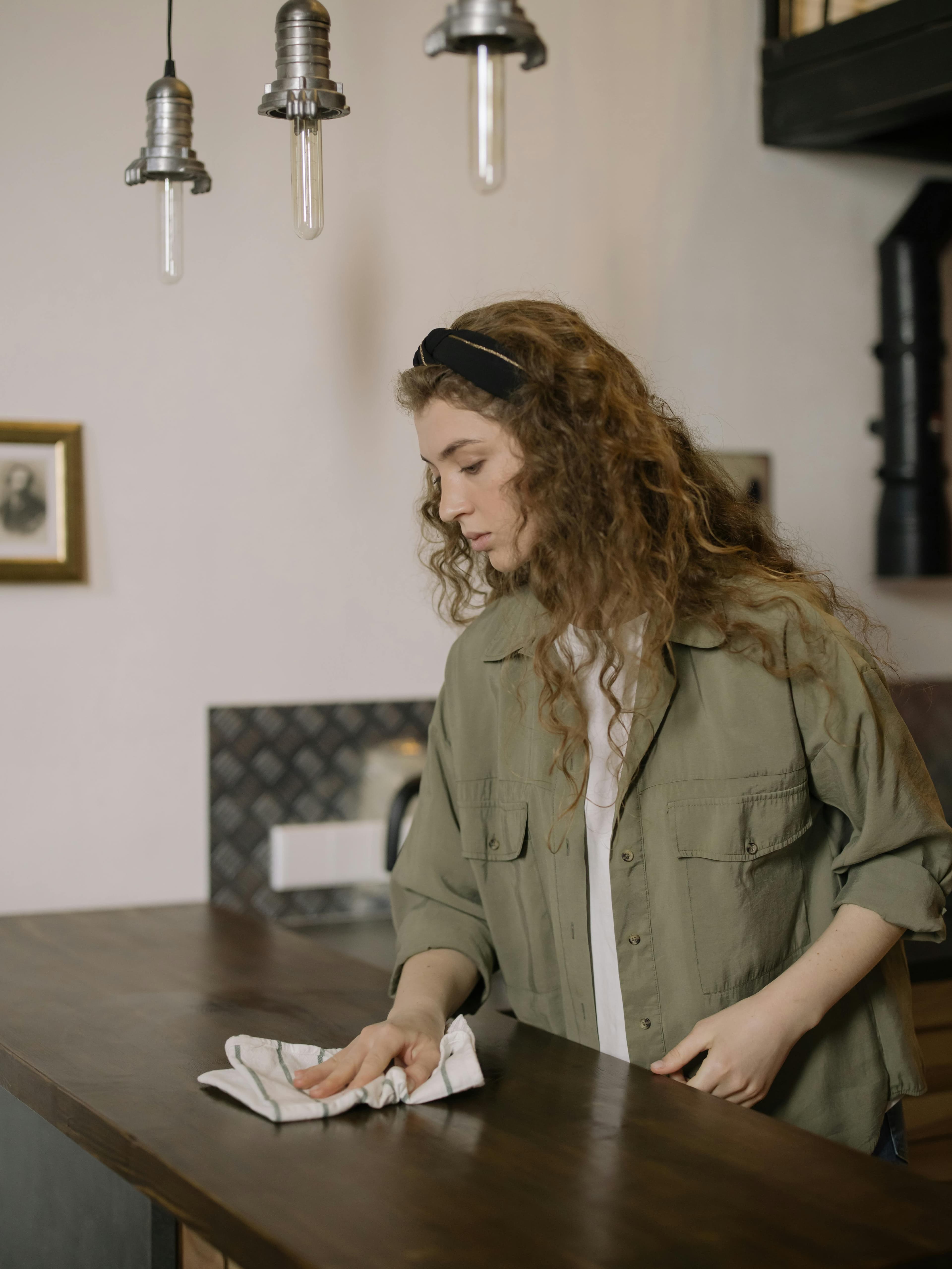 picture of a lady cleaning a surface